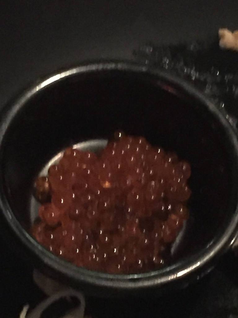 A small dish of orange fish eggs