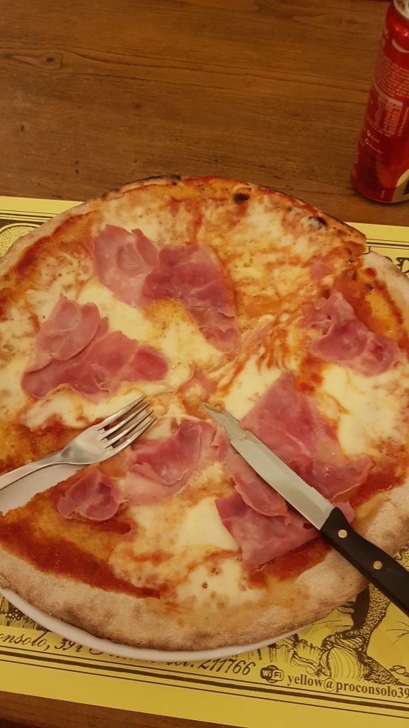 A cheese and ham pizza