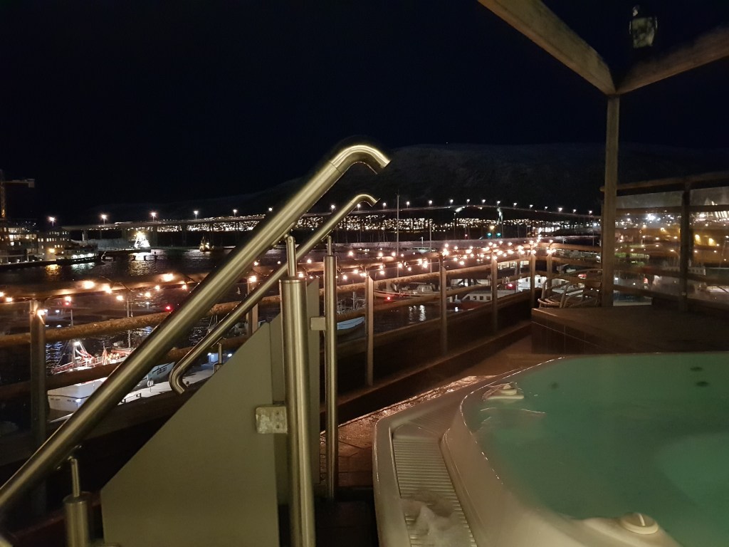 A hot tub view of Tromsø harbour, Norway