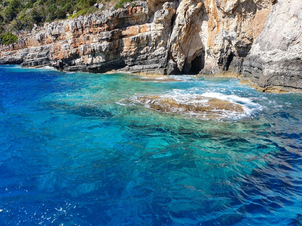 The blue waters and rock surrounding Paxos & Antipaxos, Greece