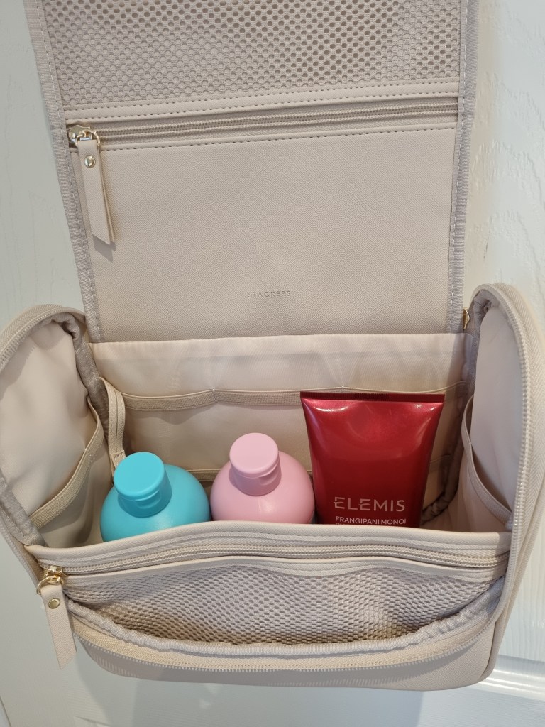 Stackers Hanging Wash Bag in Blush Pink with bottles inside