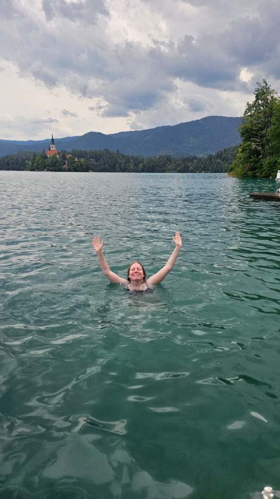Woman swimming in Lake Bled
